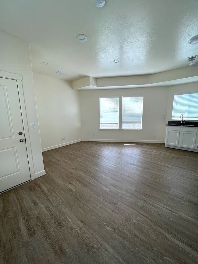 Photo - Hurry—Deposit Moves You In! | Modern 3-Bedroom Townhome with a 2-Car Garage & Private Balcony in ...