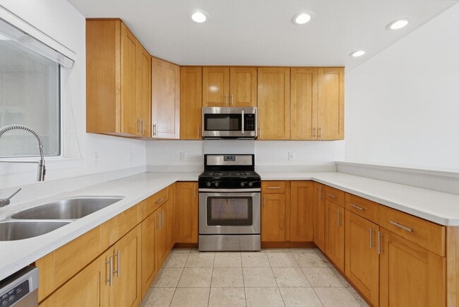 Photo - Top-Floor 3BR in Duplex Near BART | Vaulted Ceilings | In-Unit Laundry | Garage Parking