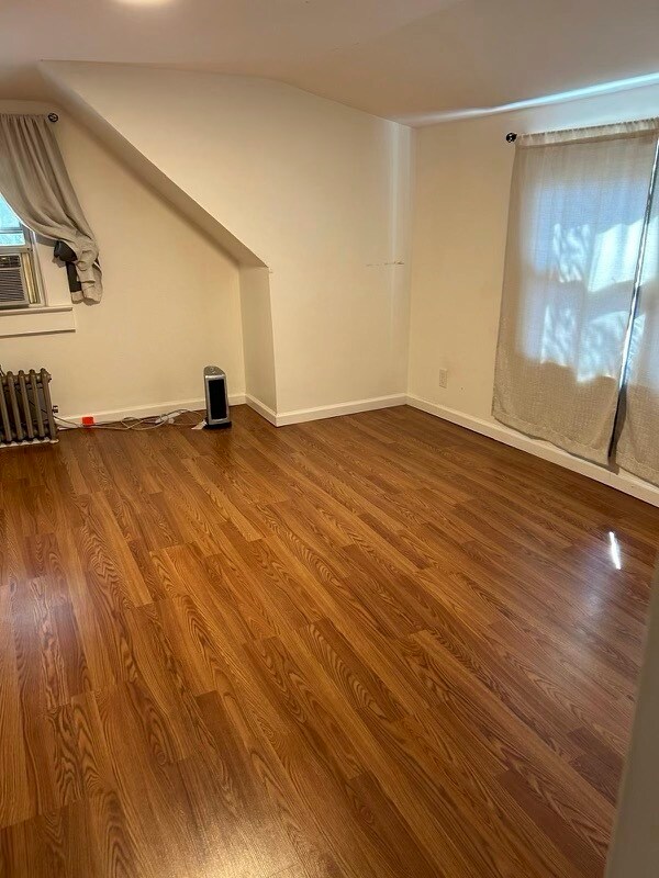 The large bedroom; more of the room. There are beautiful treetops outside the window curtain. - 565 Portland Ave Unit Beautiful Upstairs Apt