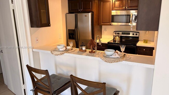 Building Photo - 7075 NW 186th St Unit C110