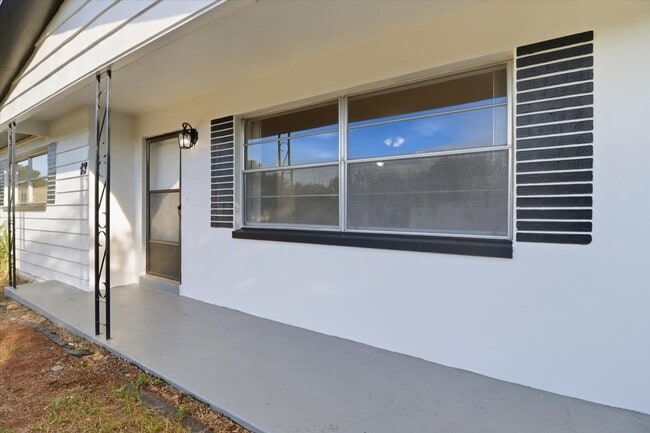 Photo - Charming Florida 2 Bedroom Bungalow with an Additional Bonus/Sunroom, Covered Parking & Patio