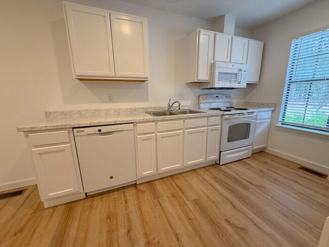 Photo - Welcome to this beautifully updated 2-bedroom, 2.5-bath lakeside condo in the highly sought-after...