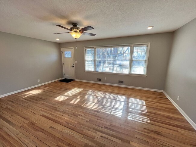 Photo - 3-Bed, 2-Bath Home with Garage & Spacious Backyard!