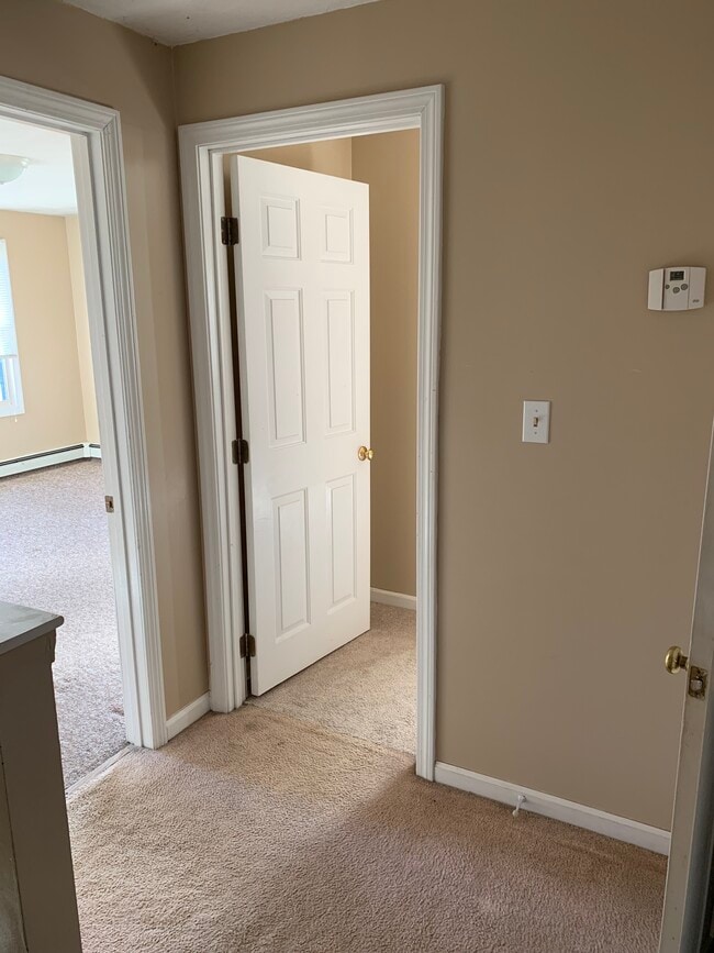 Looking into the bedroom from upstairs hallway
