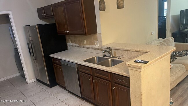Building Photo - 4959 Key Lime Dr Unit 203 Rental