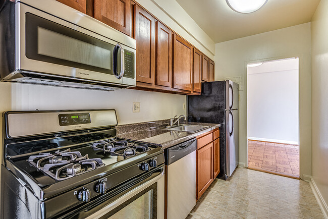 Renovated kitchen with stainless steel appliances - Idaho Terrace Apartments