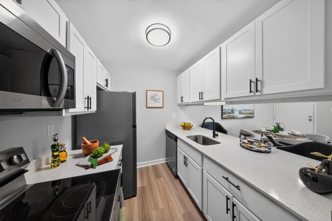 Elevate your living experience at The Woods at Ambler, an Eagle Rock Community. This modern kitchen features sleek appliances and stylish finishes, perfect for culinary adventures. Schedule a visit today to see it for yourself!