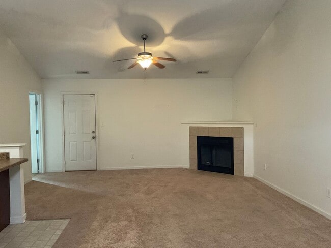 Photo - Charming 3 bedroom 2 bath home located in Maple Hill. Living room features a gas fireplace. Walk ...