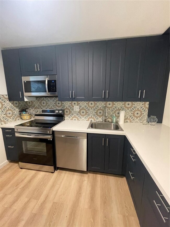 Building Photo - 8340 Sands Point Blvd Unit P309