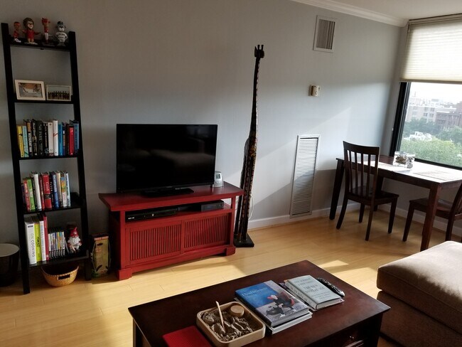 Spacious Living Room with West Facing Views - 1301 20th St NW Unit 1010
