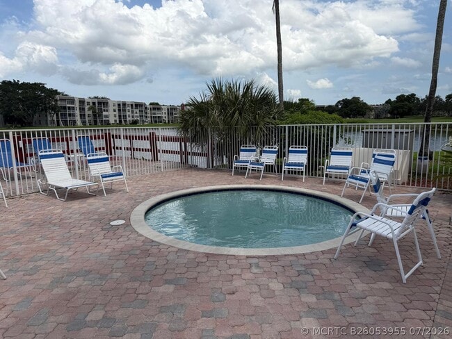 Building Photo - 9470 Live Oak Pl Unit 404