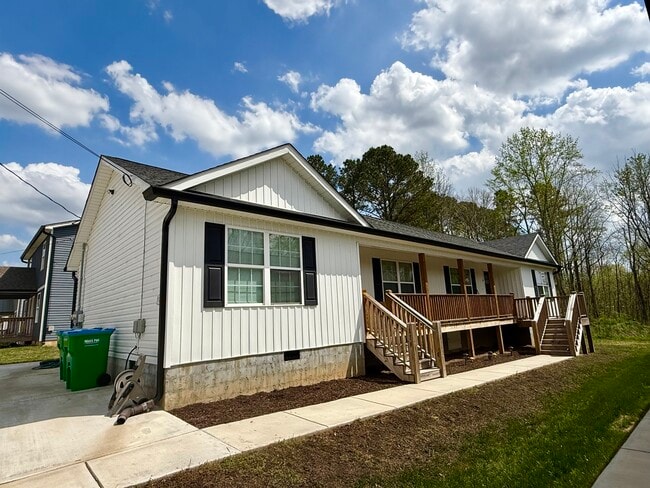 Entrance area with designated parking spaces - 111 Buster Ln Unit B
