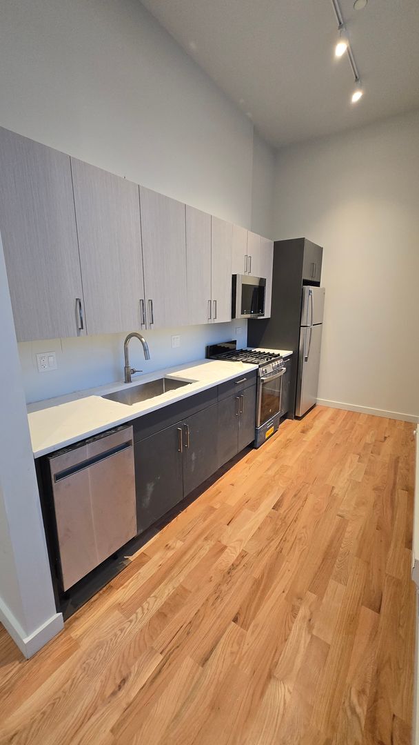 Photo - Brand New Studio in Wicker Park. 12' Ceilings. Huge Windows, Elevator Building. Roof Deck. Free I... Unit 403