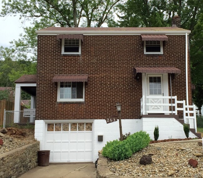 Charming all brick home and beautifully manicured fenced in yard in Penn Trafford School District. L - 263 East Fairmont Avenue