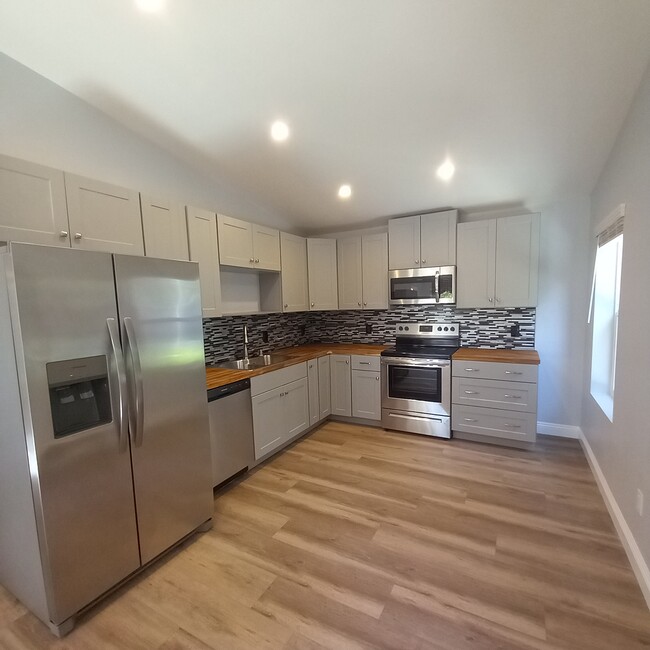 Beautiful kitchen with new stainless steel appliances, butcher block countertops - 3640 Catalina Dr House