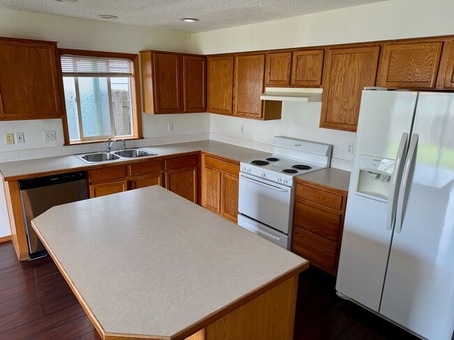 Photo - Spacious 4BR Home with Fenced Yard, 2-Car Garage & Convenient Location