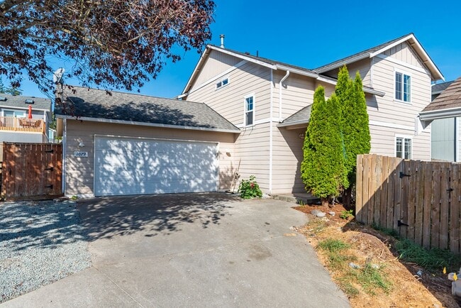 Building Photo - Spacious 4-Bedroom Home with Cozy Backyard...
