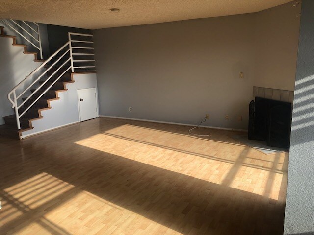 Living room w/ fireplace - 654 1st Pl Unit 2