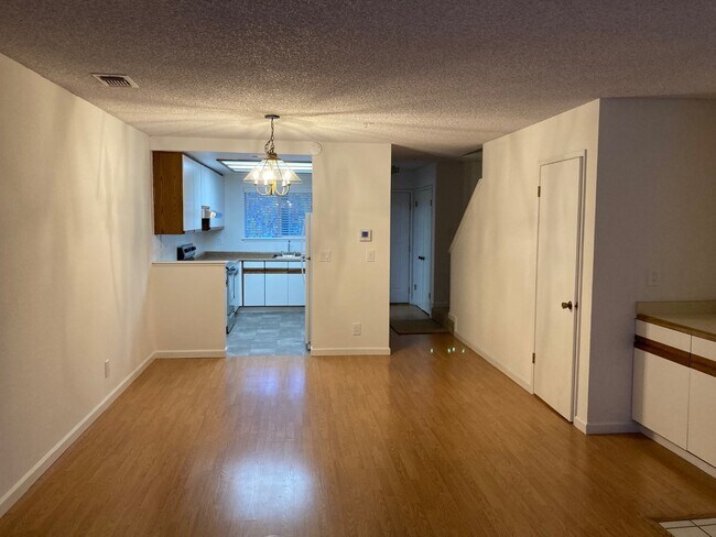 Living room looking into kitchen - 2701 Oak Rd Unit G