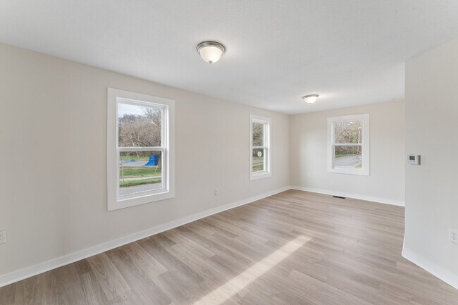 Photo - This cozy residence features a bright living space and well-appointed kitchen.  1st month is FREE...