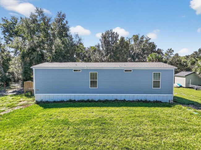 Photo - Brand-New Home on Canal to Lake Griffin – ...