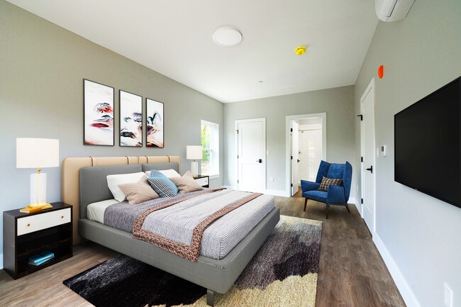 Virtually staged primary bedroom in 2 BR unit with bathroom and walk-in closet. - Lakeside of Cheshire