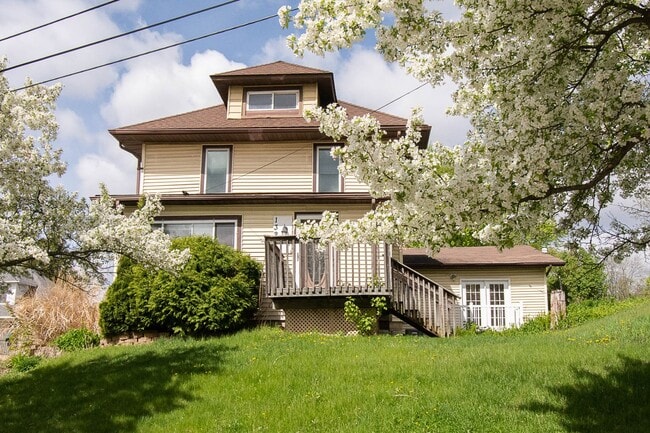 Photo - Bright, beautiful home with 3 garage spaces & tons of storage!