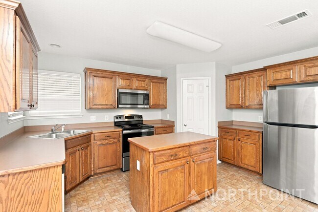 Photo - 4BR/2BA | Updated Single Family Home | 2-Car Garage Parking | Private  backyard