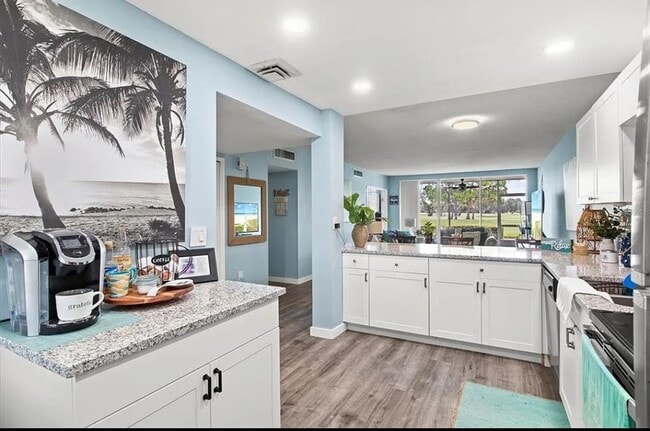 Photo - Annual OR Seasonal turnkey FURNISHED 2/2 ground floor condo with golf course and water views