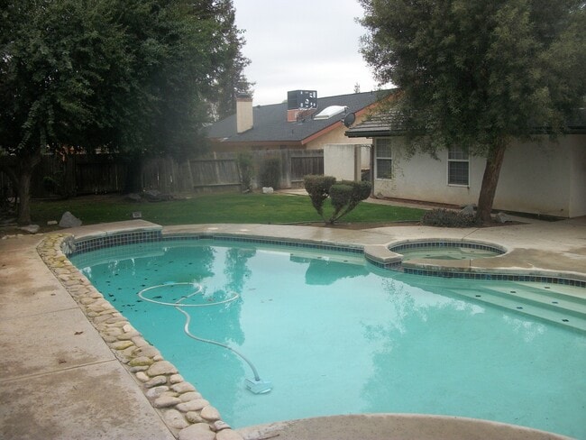 Photo - Coming Soon: Spacious Renovated 3 Bedroom Rosedale Home with Pool, Dual Fireplaces & Covered Patio