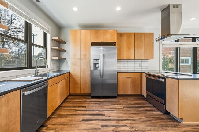 Photo - Modern and welcoming 3 bed 2.5 bath downtown retreat with second story balcony.