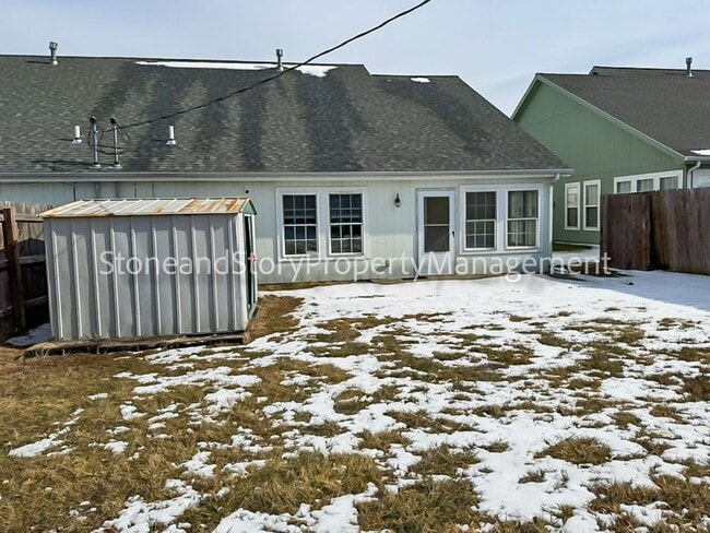 Photo - 2 bedroom 1.5 bath duplex with sunroom, 2 car garage and fenced yard