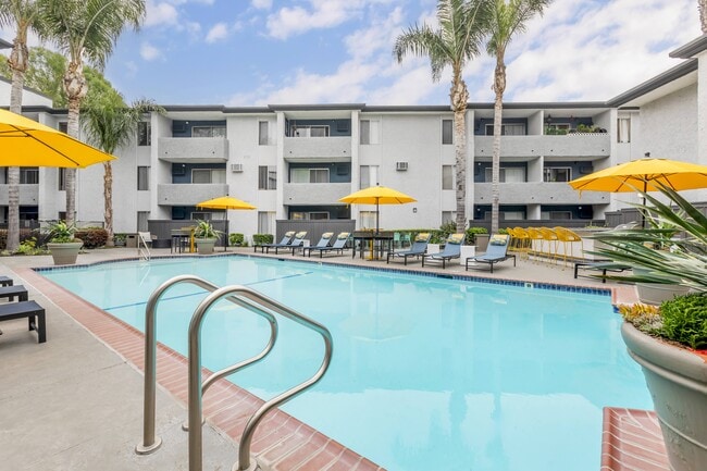 Experience luxury living, where our pool area is a vibrant retreat. From the cheerful yellow umbrellas to the updated tables and chairs, every detail is designed for your relaxation and enjoyment.