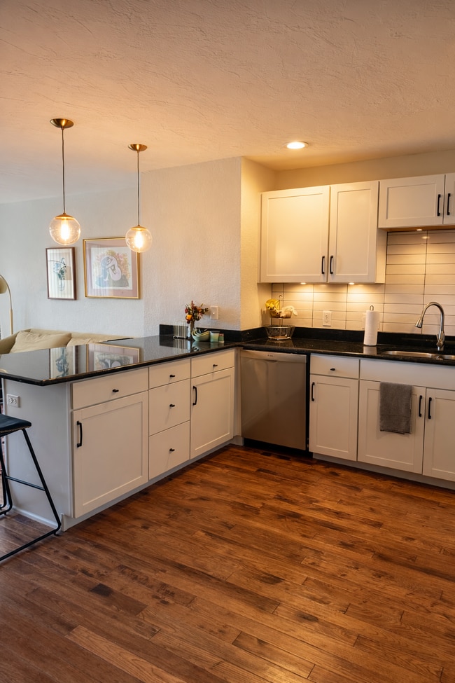 Exceptionally large kitchen for a two-bedroom townhome with eat-at counter and abundant cabinetry. - 524 Superior St