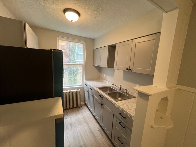 Photo - Spacious, Newly Updated 1-Bed Near UC & Downtown — Off-Street Parking, Radiant Heat Unit 3
