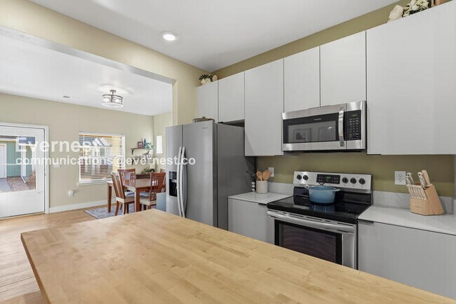 Photo - 4 Bed/3 Bath Townhome with Fenced Yard & Garage / Available Now!