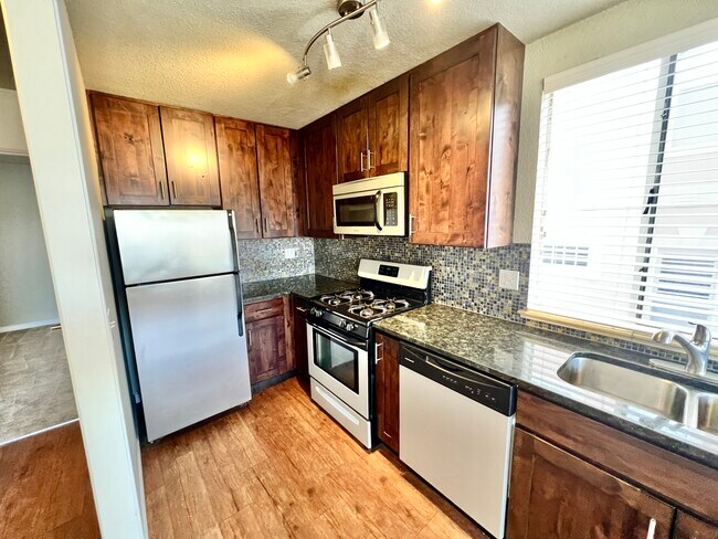 Experimente cocinar con estilo con esta moderna configuración de cocina. - Sublime