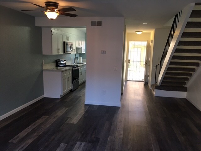 Open Plan-Living Room Townhouse with wood flooring