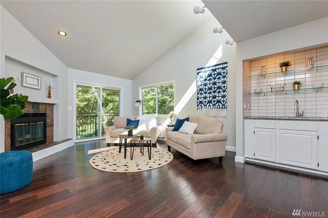 Well lite living room with gorgeous hardwood floors - 9800 Roosevelt Way NE Unit #31