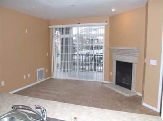 Living room with patio access - 3852 S Dallas St Unit 106