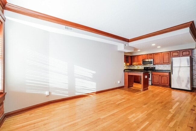 Photo - Charming 1-Bedroom Apartment with Exposed Brick, Hardwood Floors & Updated Kitchen