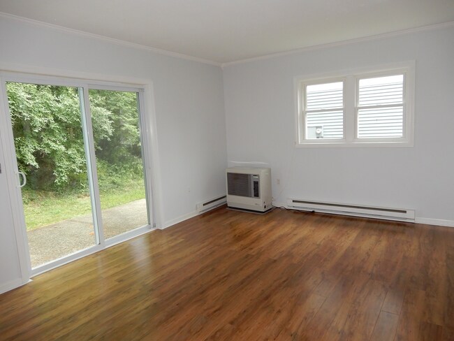 Living room with sliders to private patio - 24 Witham St Unit 12