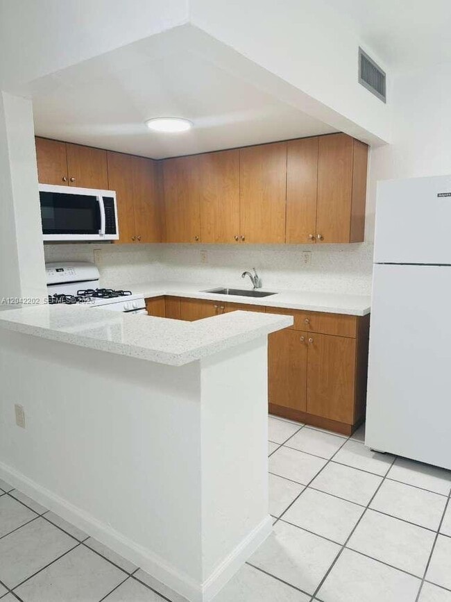 Photo - 1230 W 54th St Unit 202A