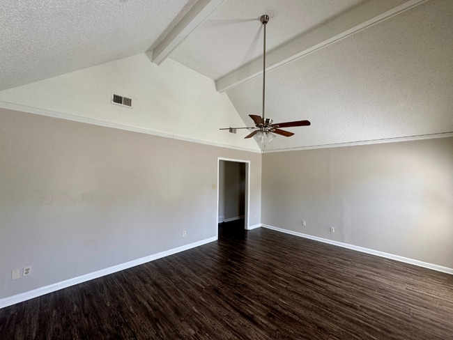 Photo - Charming 3BR/2BA Near Southwind | Soaring Vaulted Ceilings, Brick Fireplace & Fenced Yard