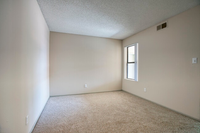 The bedroom includes a large closet and sits next to the full bathroom