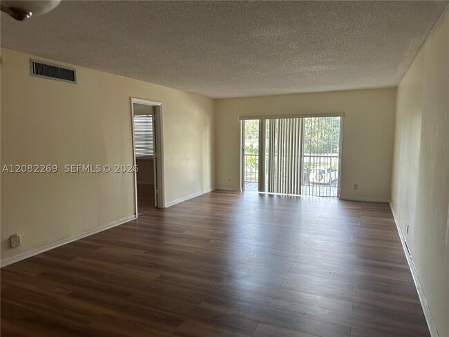 Building Photo - 3360 Spanish Moss Terrace Unit 203