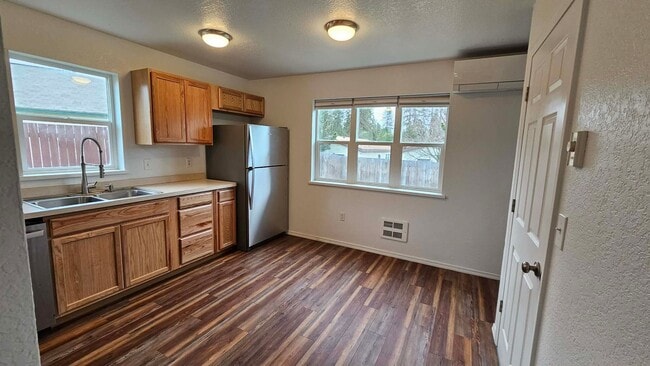 Photo - House with fenced yard and garage