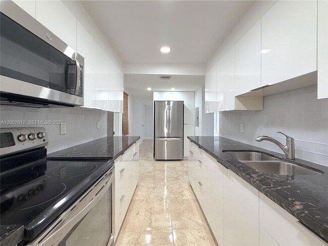 Building Photo - 1075 92nd St Unit 201