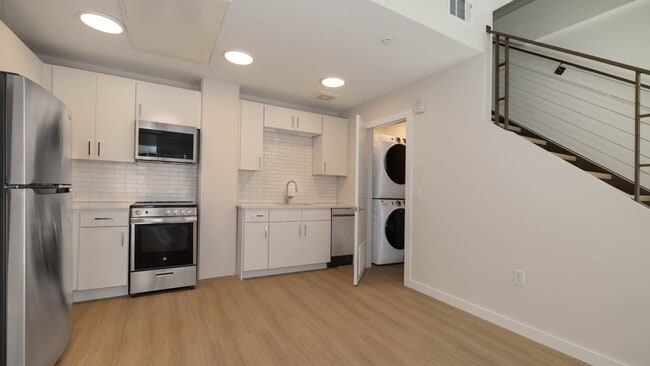 Kitchen with In-home Washer and Dryer - Skyhouse Denver