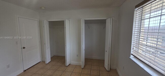 Building Photo - 7475 W 22nd Ave Unit 206